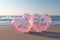 Two pink Heart-shaped transparent bubbles on the beach for wedding decoratio