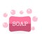 Two pink soap bars with foam soap bubbles