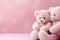 Two pink teddy bears in a sweet embrace. Plush love. Pink teddy bears hugging each other on a pink background with copy space.