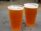 Two pint glasses of delicious crafted IPA beers Shallow depth of field