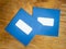 Two plain blue windowed envelopes