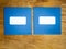 Two plain blue windowed envelopes side by side