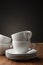 Two plain white pottery tea or coffee cups