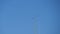 Two planes fly side by side and crossing close together during an airshow against blue sky. Aerobatics. Close-up