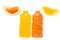 two plastic bottles with juice from orange and grapefruit, next to slices of orange and grapefruit