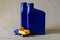 Two plastic canisters with car oils and a toy dump truck