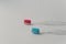 Two plastic toothbrushes for hygiene cavity mouth with lateral side isolated over white background. Dental concept