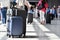 Two plastic travel suitcases in the airport hall