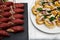 Two plates with snacks on a buffet table. Selection of tasty bruschetta or canapes on toasted baguette with potatoes herring fish,