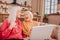 Two pleasant-looking elderly grey-haired women laughing loudly