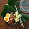 Two poke bowl fried rice chicken meat eggs box top view Asian take away food