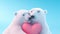 two polar bears hugging each other and holding a pink heart