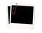 Two polaroid frame photo prints, red paperclip isolated on white background