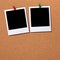 Two polaroid style photo print frames pinned to a cork board