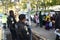 Two police officers watch children and adults in Halloween parade