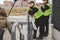 Two policemen standing by the stairs