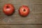 Two pomegranates on a wooden table. Healthy fruits, vegan food, diet. Flat lay. Top view. Copy space.