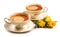 Two porcelain antique cups with tea and yellow roses