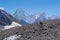 Two porters walk toward to Concordia camp, K2 trek, Pakistan