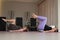 Two pregnant women doing Pilates with special small fit balls.