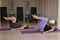 Two pregnant women doing Pilates with special small fit balls.