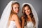 Two pretty brides portrait in studio