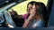 Two pretty girls in car paving travel route on map