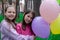 two pretty teenage girls friends with colorful balloons in park. happy kids. summer days. vacation, holidays. friendship