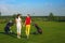 Two pretty women golfers walking at golf course