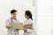 Two professional asian man and woman doctor discussing on laptop to analyse patient person