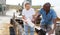 Two proffesional farmers is feeding newborn calf from bottle at cow farm