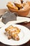 Two pumpkin ginger scones on a white round plate with asian tea pot