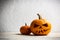 Two pumpkins on wooden table