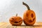 Two pumpkins on wooden table