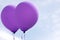 Two purple helium balloons horizontal