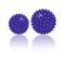 Two purple spiny massage balls isolated on white. Concept of physiotherapy or fitness. Closeup of a colorful rubber ball