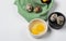 Two quail eggs in a bowl for cooking on the background of quail eggs and eggshells. Diet food concept