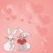 Two rabbits with heart shaped gifts with heartful background demonstrate couples exchanging offerings. Bunnies represent