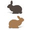 Two rabbits are sitting, silhouettes for decoration, on white ba