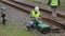 Two railway employees performing maintenance