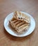 Two Rangi cookies on a white plate