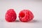 Two raspberry tasty sweet bright on white background copy space macro