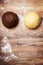 Two raw dough balls for cookies or shortcrust pastry, chocolate and vanilla flavoured