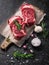 Two raw fresh marbled meat black angus steak ribeye, garlic, salt