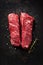 Two raw hanger steaks, also known as butcher`s steak or hanging tenderloin