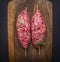 Two raw kebab skewer vintage cutting board wooden rustic background top view close up
