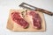 Two raw marble beef new york steaks on craft paper