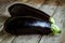 Two raw organic eggplant on old wooden background