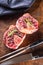 Two raw pieces beef shank on wooden butcher board with fork and