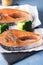 Two Raw Salmon Fish Steak with Thyme Herb Blue Background Fresh Fish Above Vertical